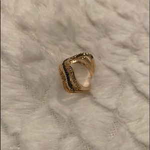 Brazilian gold plated ring.  With two colors with and black stones size 8.